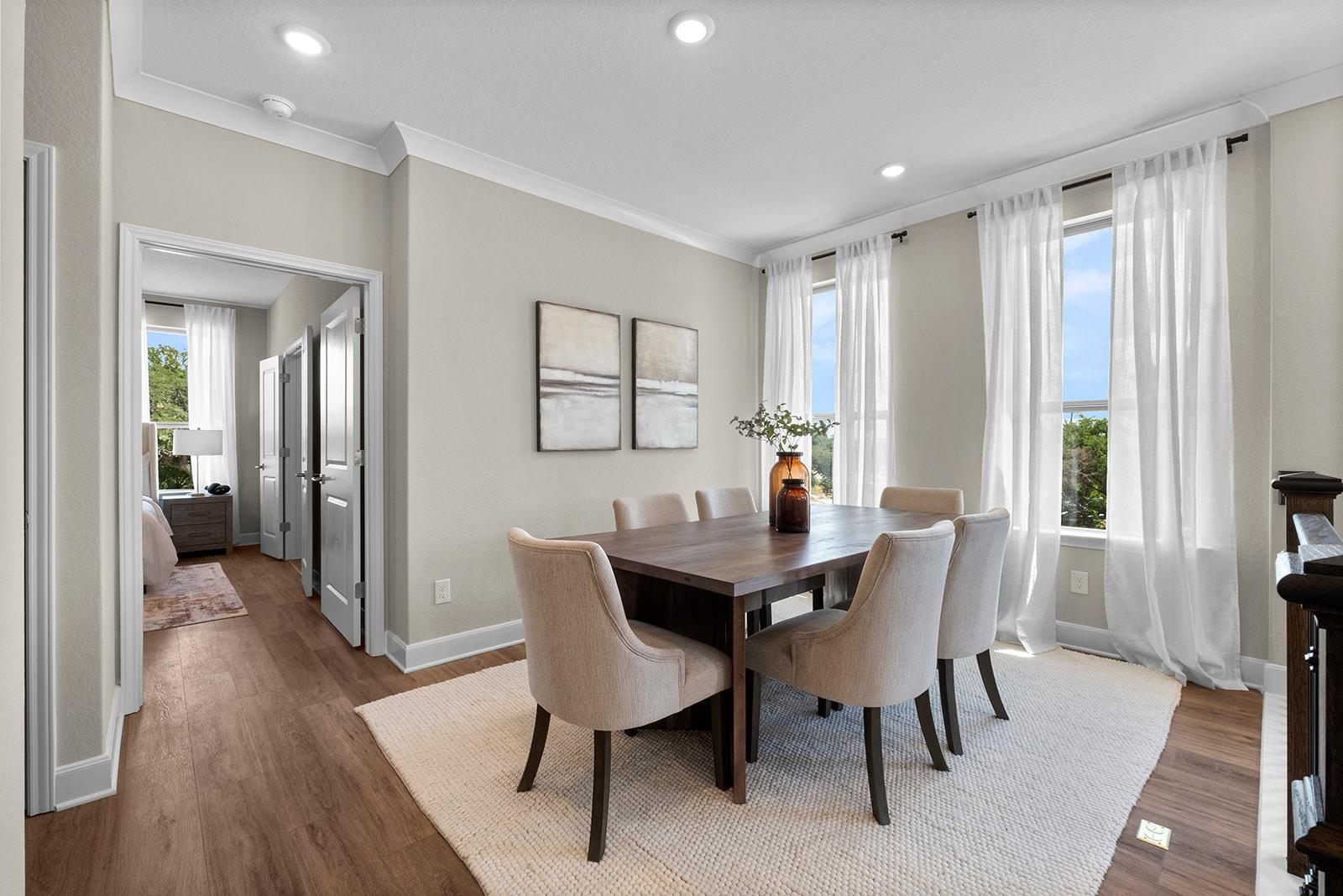 Dining room with warm greige walls and white trim