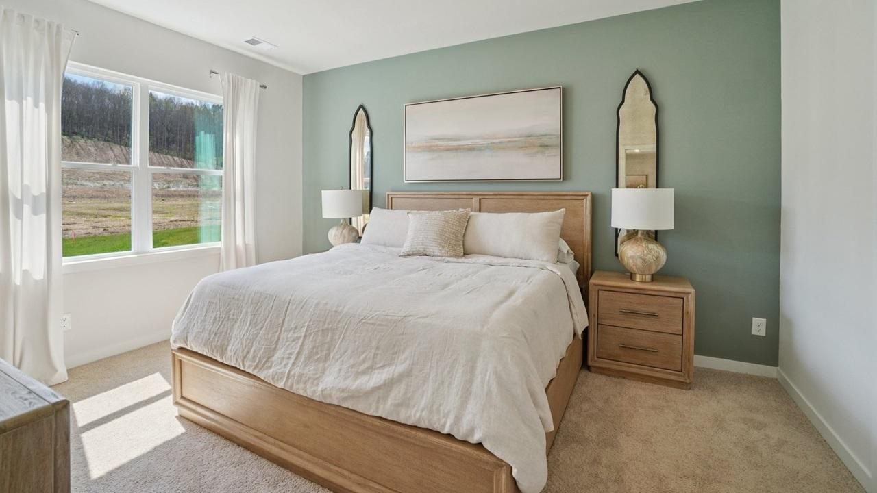 Bedroom with a sage green accent wall